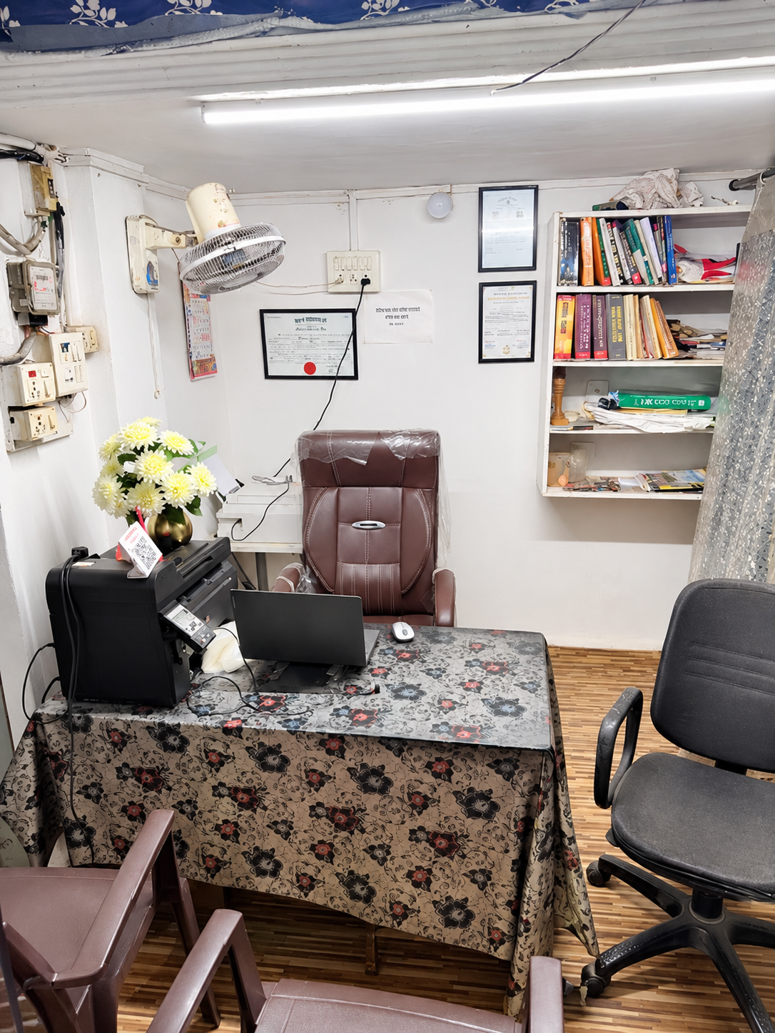 Enhanced office interior showing the consultation desk, seating and law books